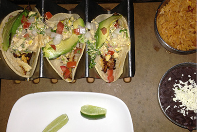 Baja tacos with grilled market fish, Mexican slaw, tomato, corn, avocado and chipotle aioli